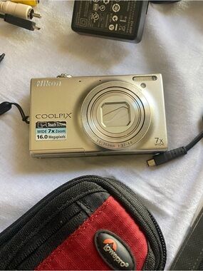 Nikon  Coolpix Silver Compact Camera with all the accessories & carry case.